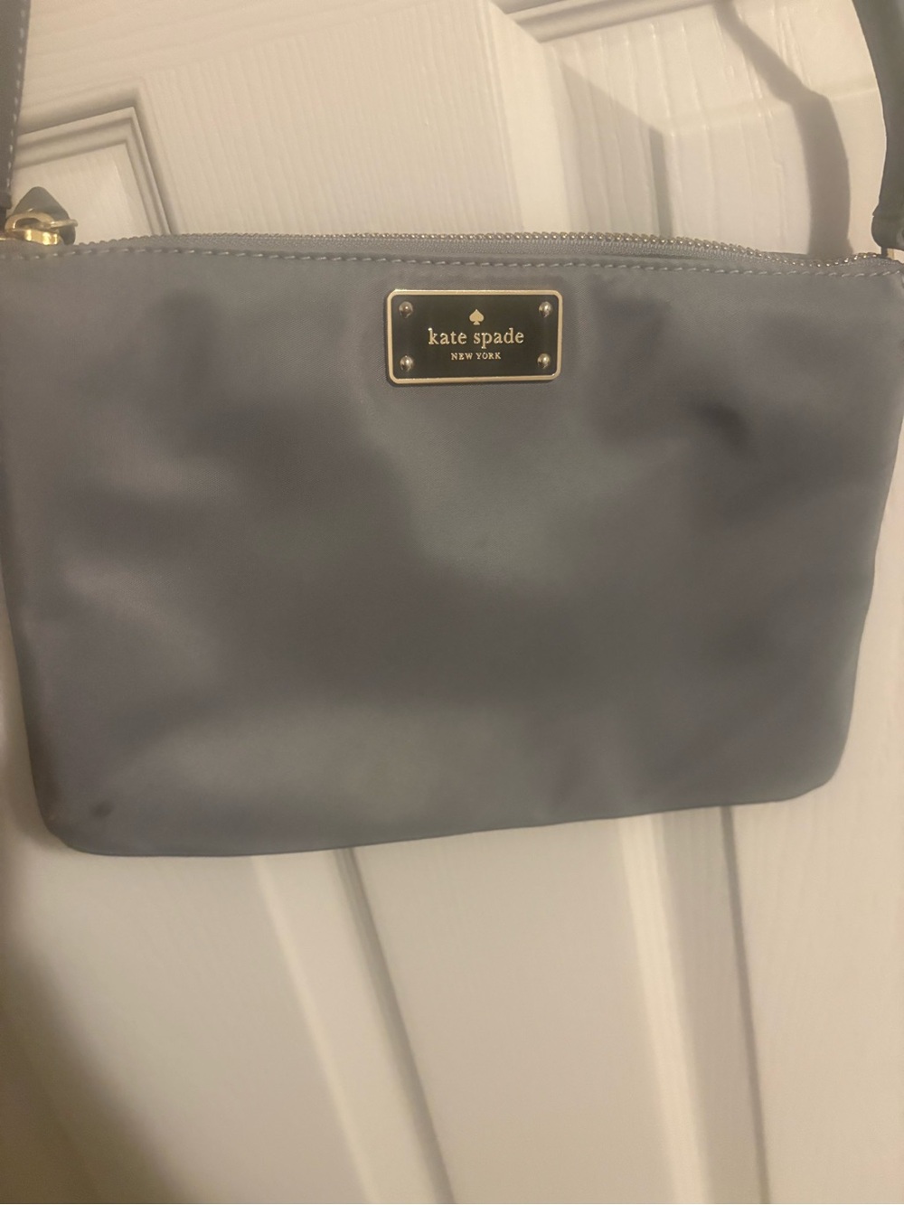 kate spade gray nylon crossbody with gold logo plate